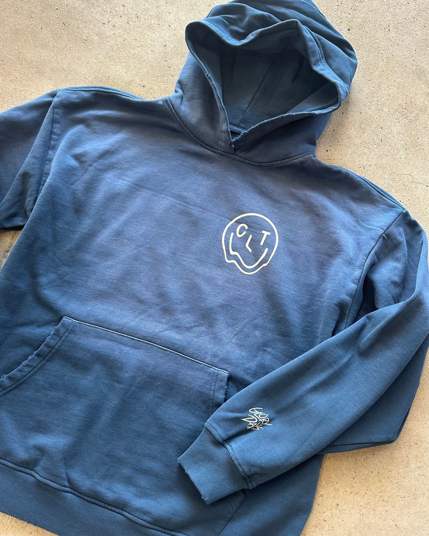 Glory Days Apparel - Melty CLT Smiley Sun Faded Blue Hoodie