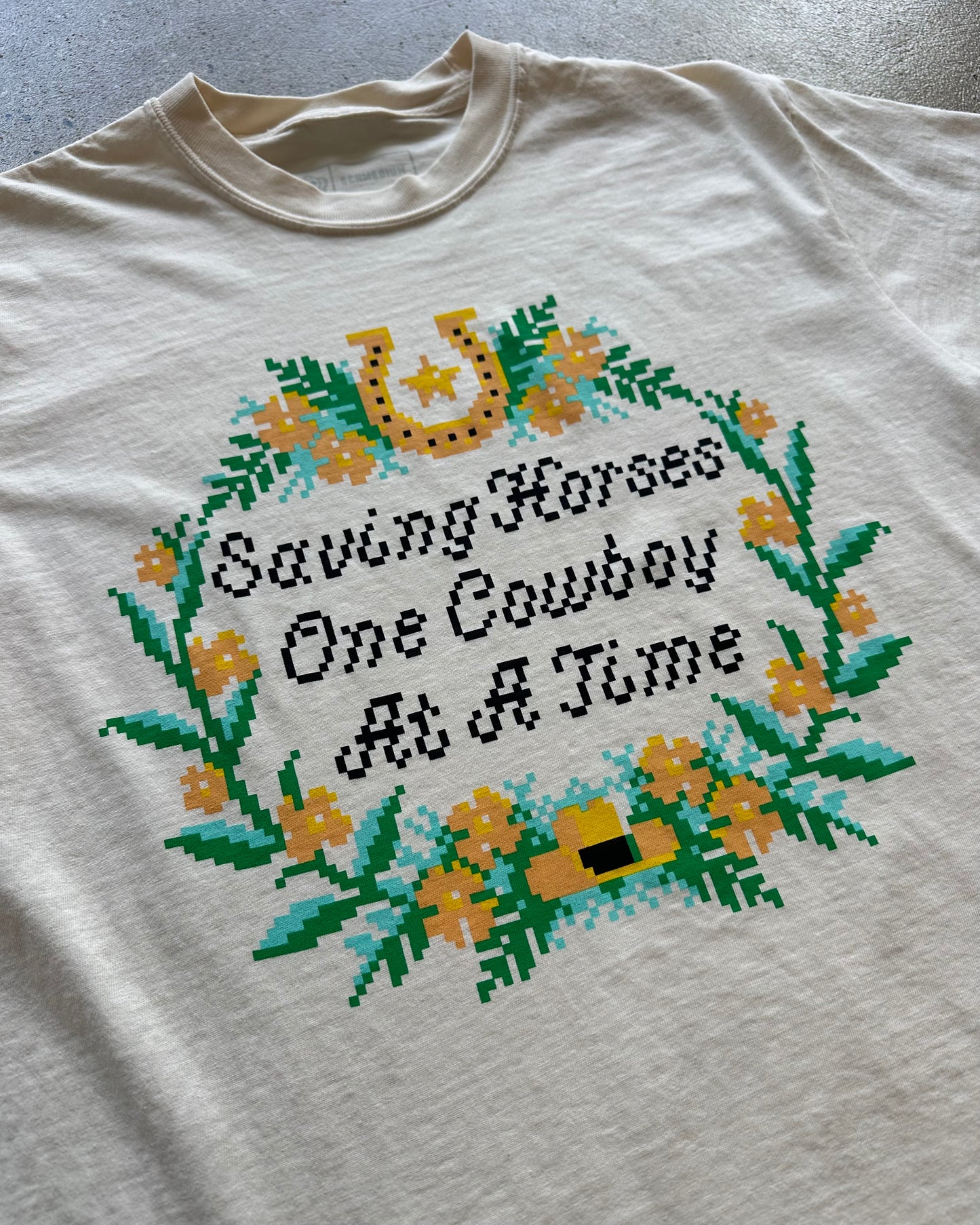 Glory Days Apparel - Cross Stitch Saving Horses One Cowboy At A Time T-Shirt