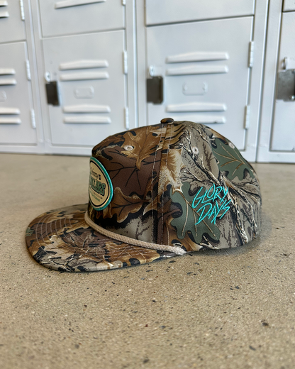 Glory Days Apparel - Johnny Dollars Patch Real Tree Camo Rope Hat